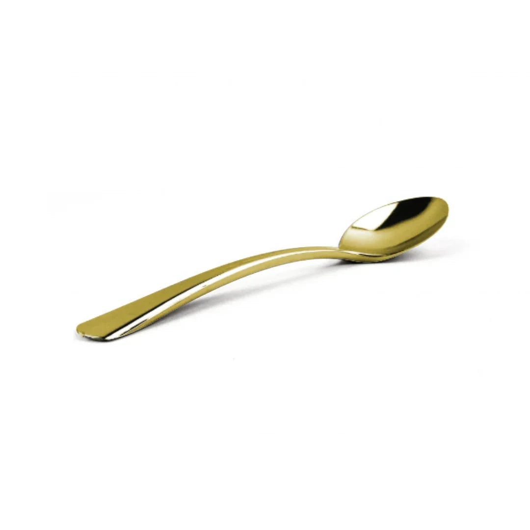 Elegant gold-colored plastic disposable spoon on a white background