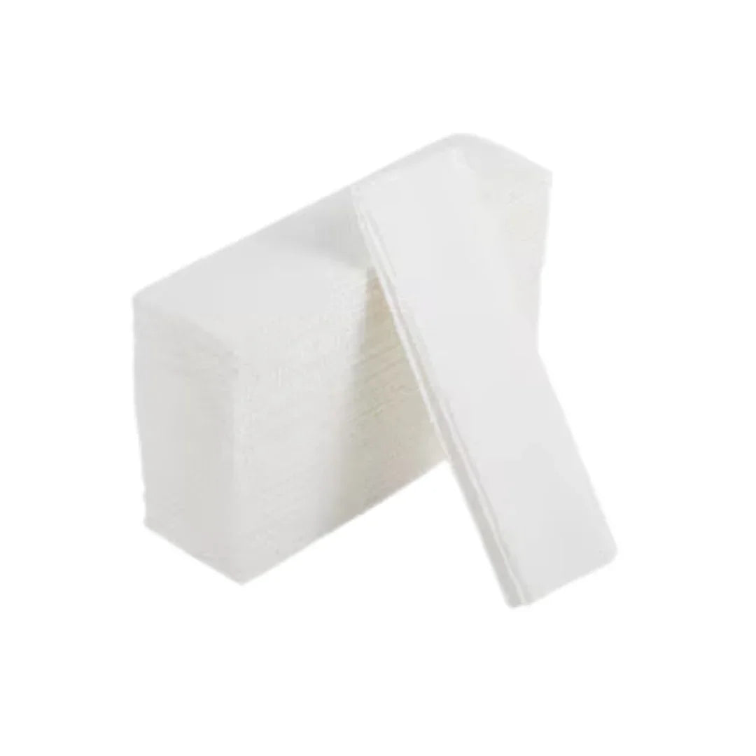Stack of white disposable paper napkins