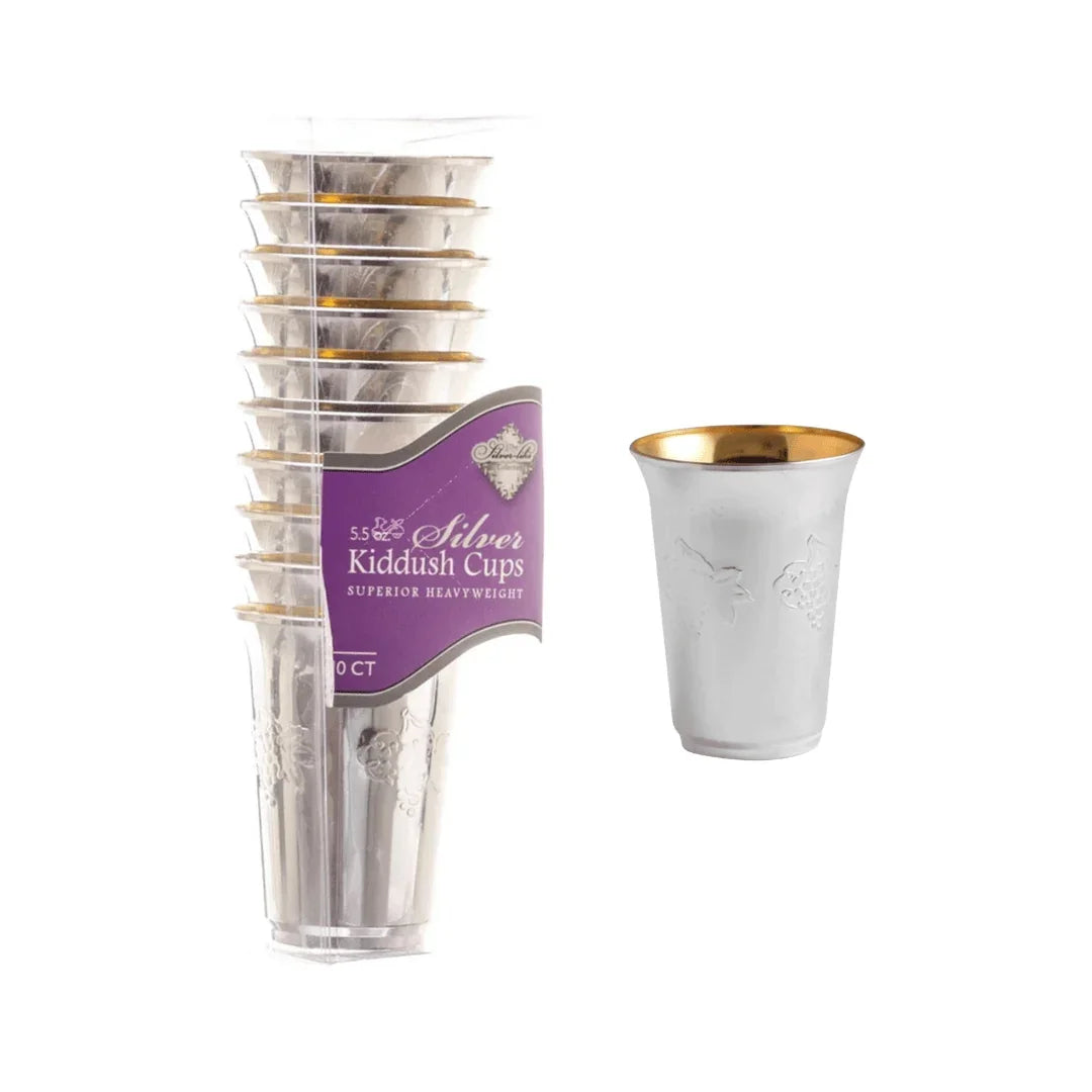 Stack of silver heavyweight Kiddush cups with gold rims and embossed vine patterns.