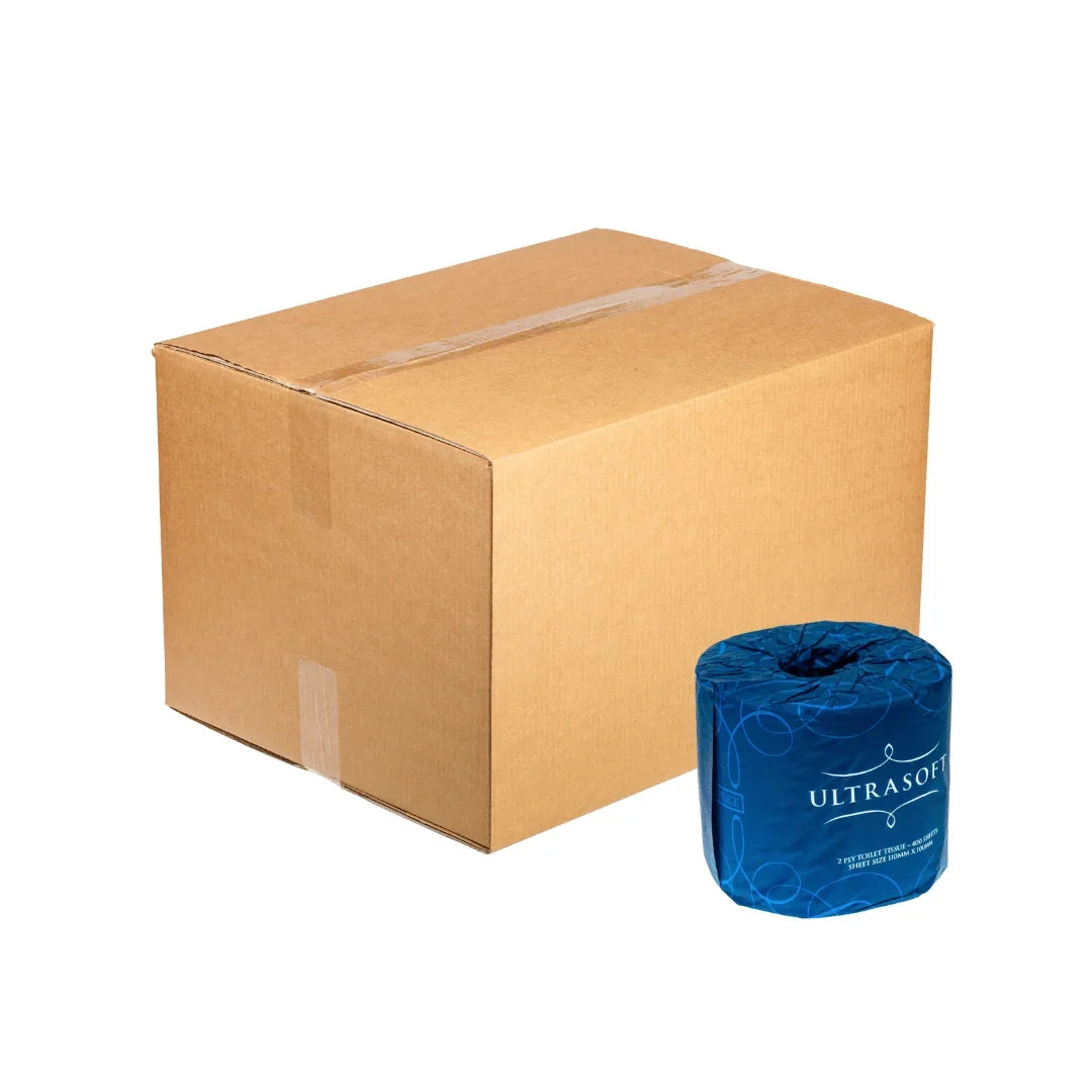 A roll of blue UltraSoft toilet paper next to a large brown cardboard shipping box.