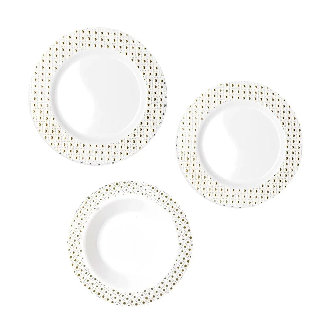 Three white disposable plates with gold glitter dotted borders on a white background