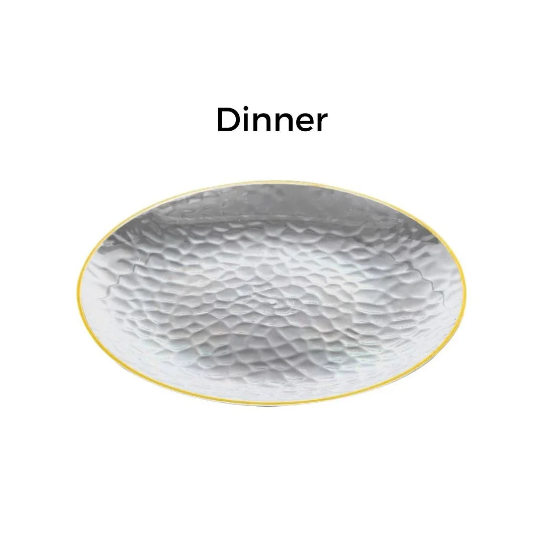 Silver hammered metal dinner plate with a gold rim