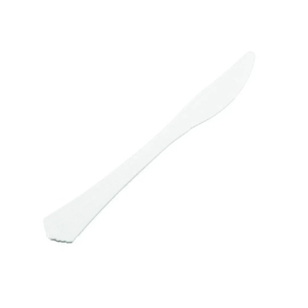 White disposable plastic knife isolated on a white background