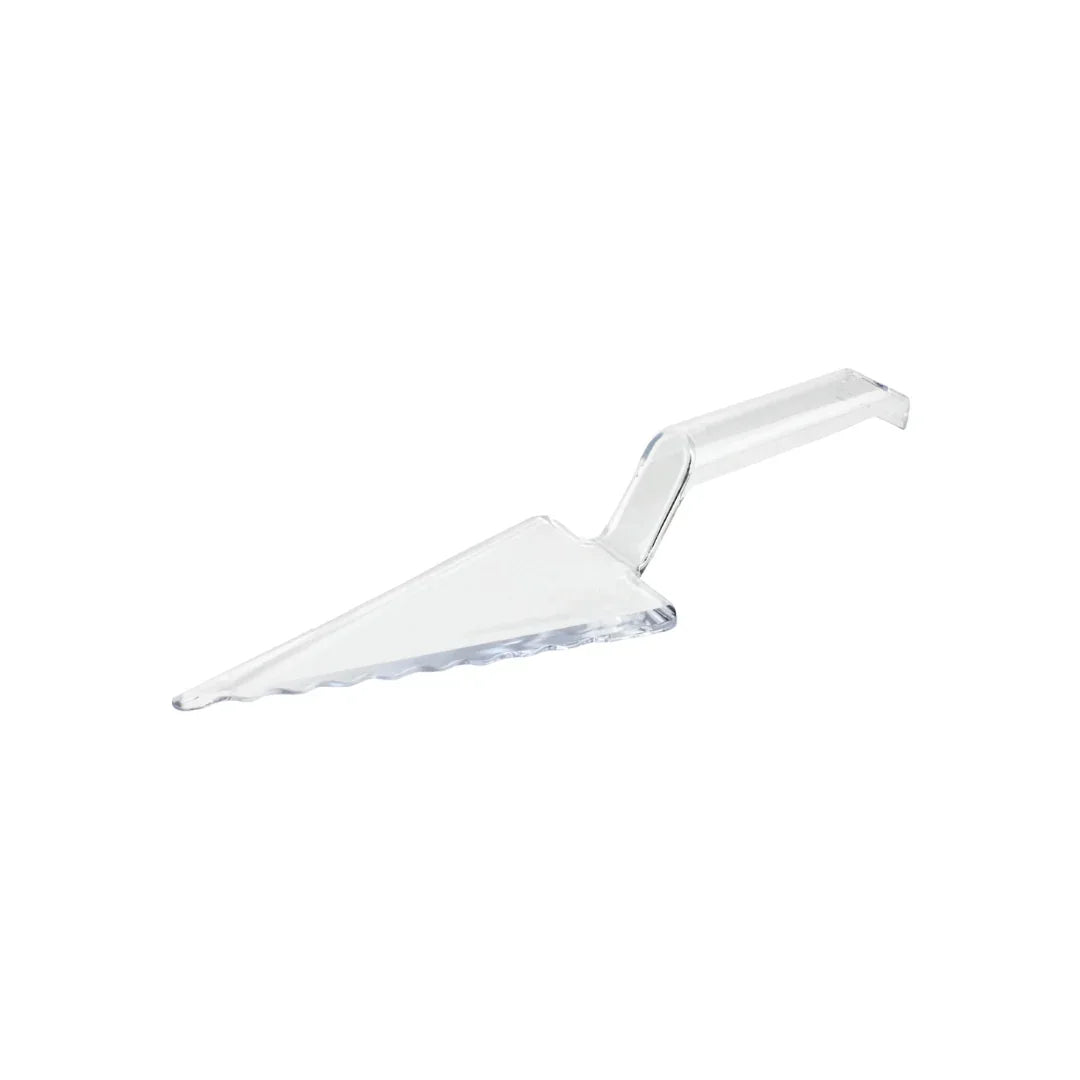 Clear plastic cake server with serrated edge on a white background
